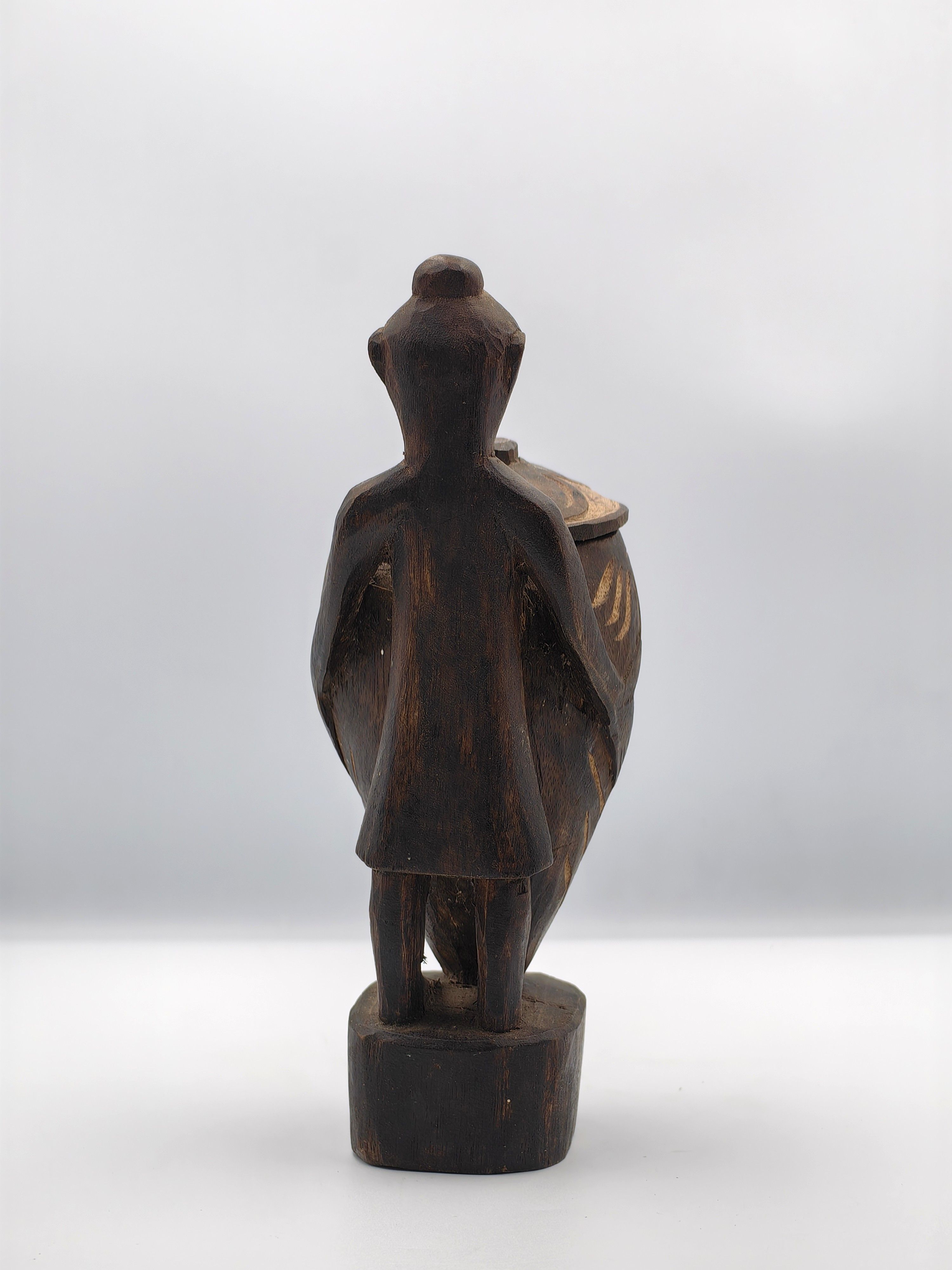 20th Century Palawan Wood Carving of a Couple Holding Large Jars - Additional view